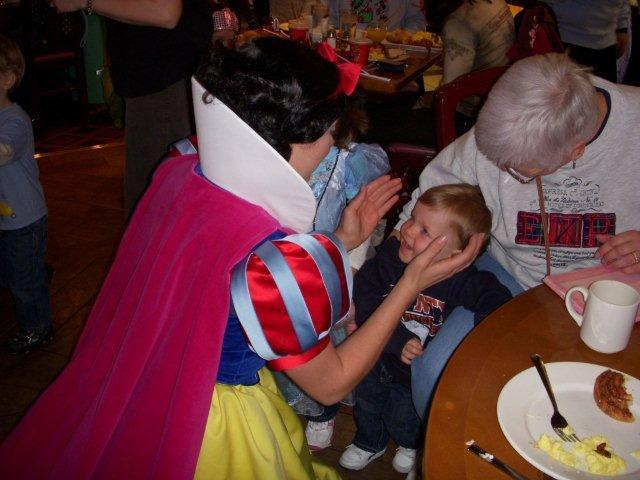 My nephew getting his first kiss from Snow White